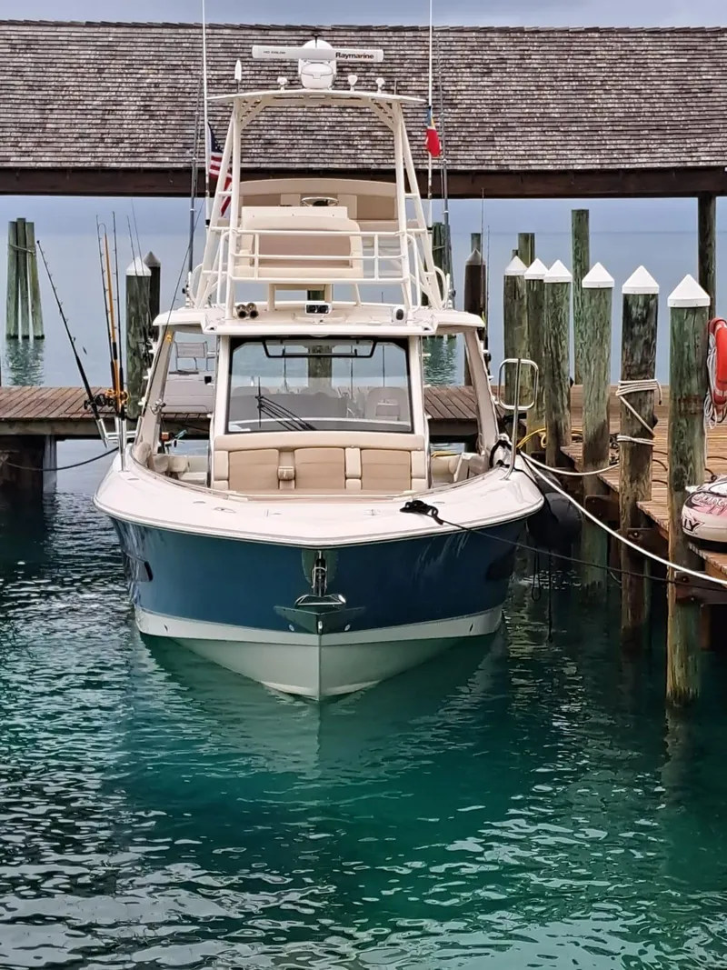 Slide: The Image of 2016 Boston Whaler 420 Outrage docked at a marina. - 4