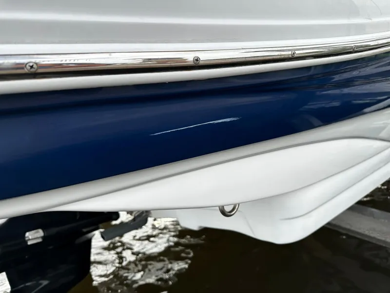 Slide: The Image of 2016 Crownline 285 SS boat with a scratch on the blue hull. - 10