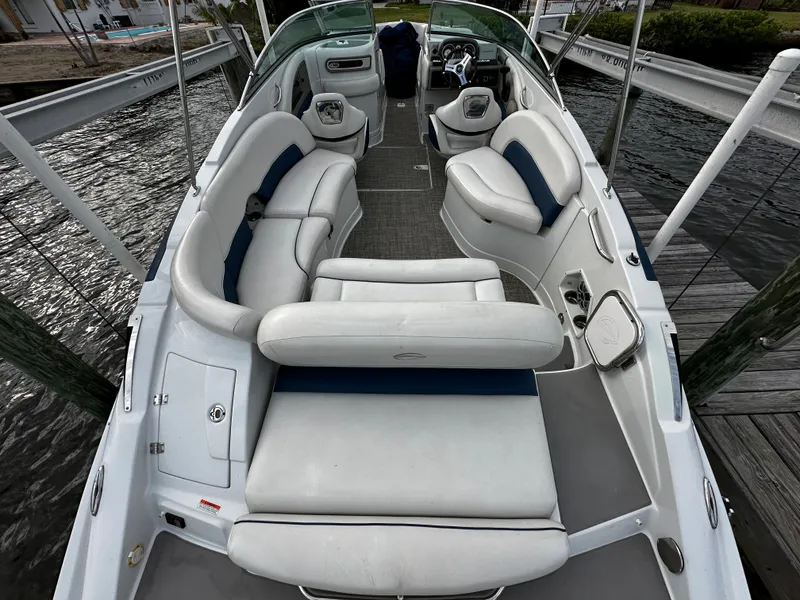 Slide: The Image of 2016 Crownline 285 SS boat with spacious seating and modern interior. - 13