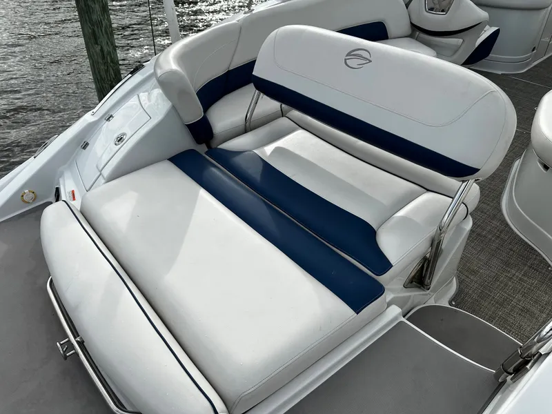 Slide: The Image of 2016 Crownline 285 SS boat with white and blue seating. - 16