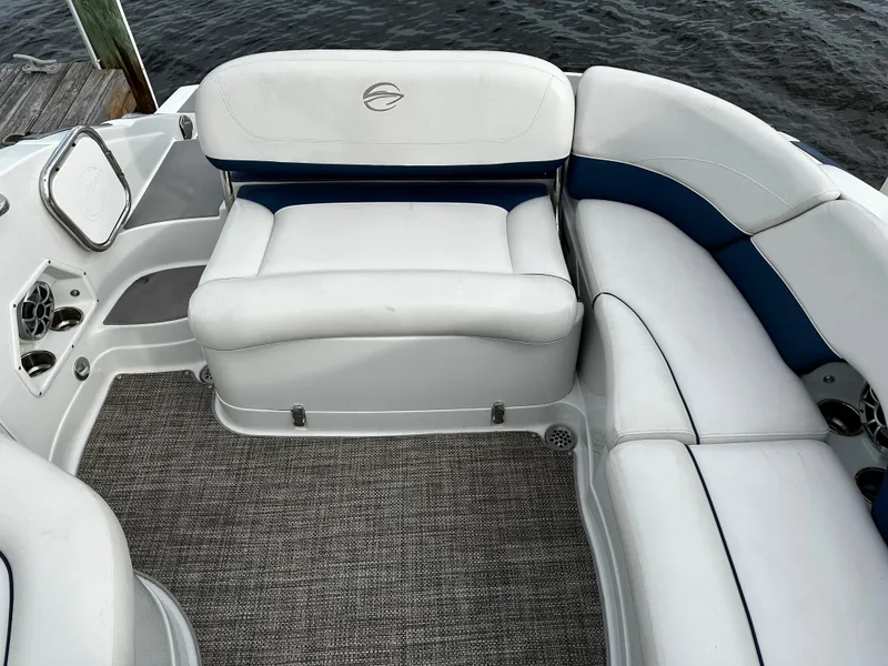 Slide: The Image of Interior seating of a 2016 Crownline 285 SS boat with white and blue upholstery. - 17
