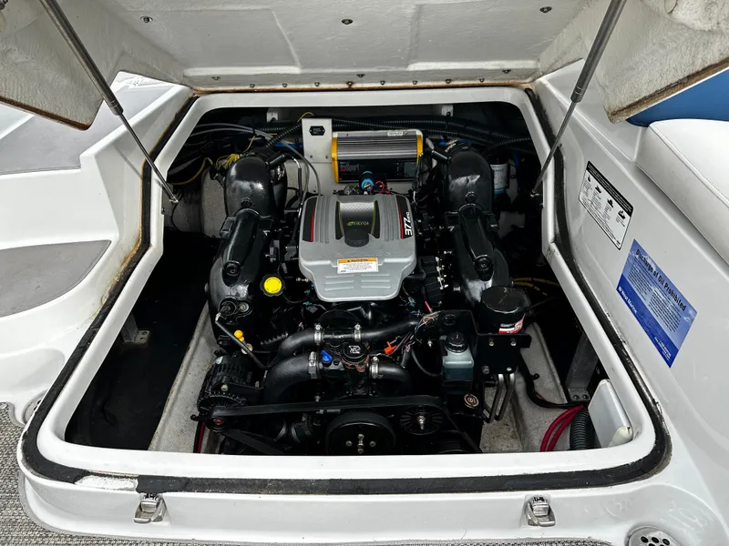 Slide: The Image of 2016 Crownline 285 SS boat engine compartment with open hatch. - 21