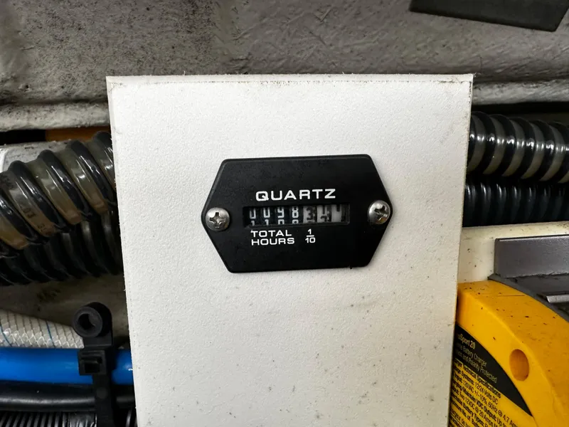 Slide: The Image of Hour meter on a 2016 Crownline 285 SS boat showing 148.1 total hours. - 24