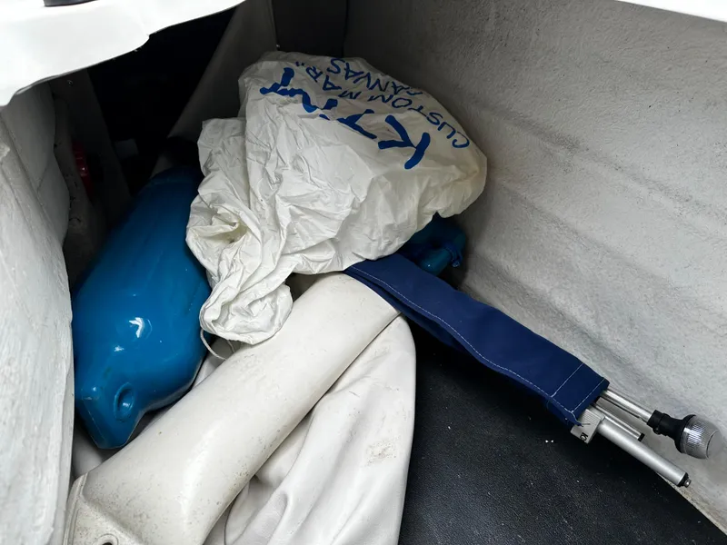 Slide: The Image of Storage compartment of a 2016 Crownline 285 SS boat with various boating accessories. - 29