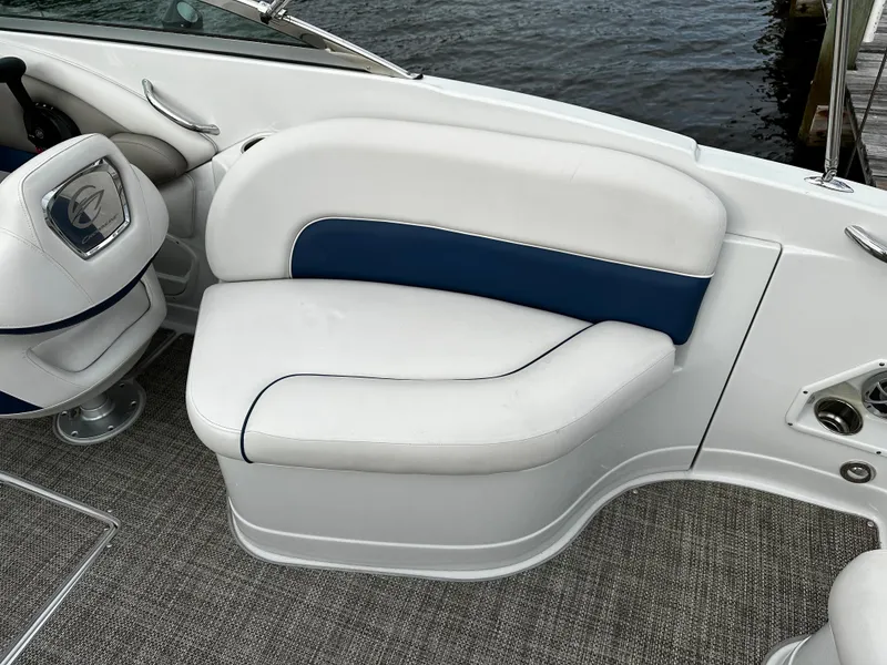 Slide: The Image of 2016 Crownline 285 SS boat interior seating with white and blue upholstery. - 30