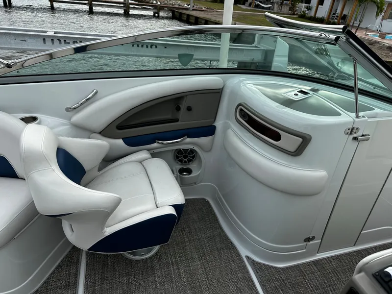 Slide: The Image of Interior of a 2016 Crownline 285 SS boat with white and blue seating. - 31