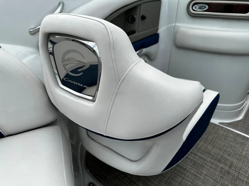Slide: The Image of 2016 Crownline 285 SS boat interior with white and blue seating. - 32
