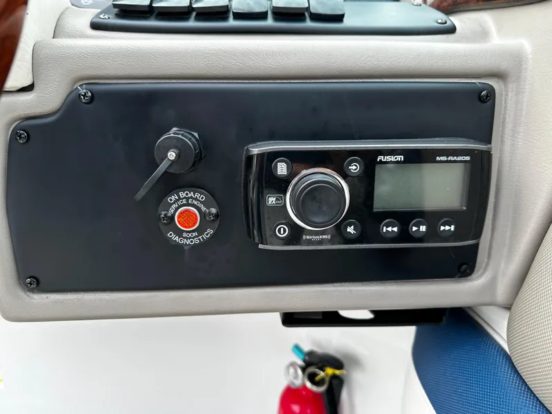 Slide: The Image of Control panel of a 2016 Crownline 285 SS boat with Fusion MS-RA205 stereo system. - 44