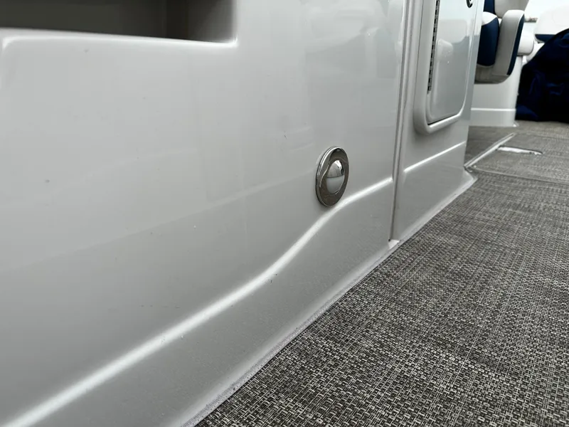 Slide: The Image of 2016 Crownline 285 SS interior detail with carpeted flooring. - 46