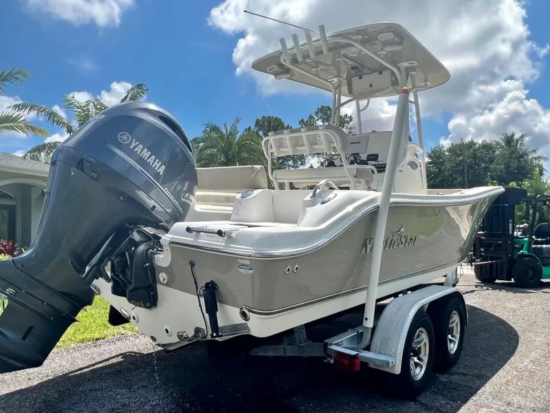Slide: The Image of 2018 NauticStar 22 XS boat with Yamaha outboard engine on trailer. - 18
