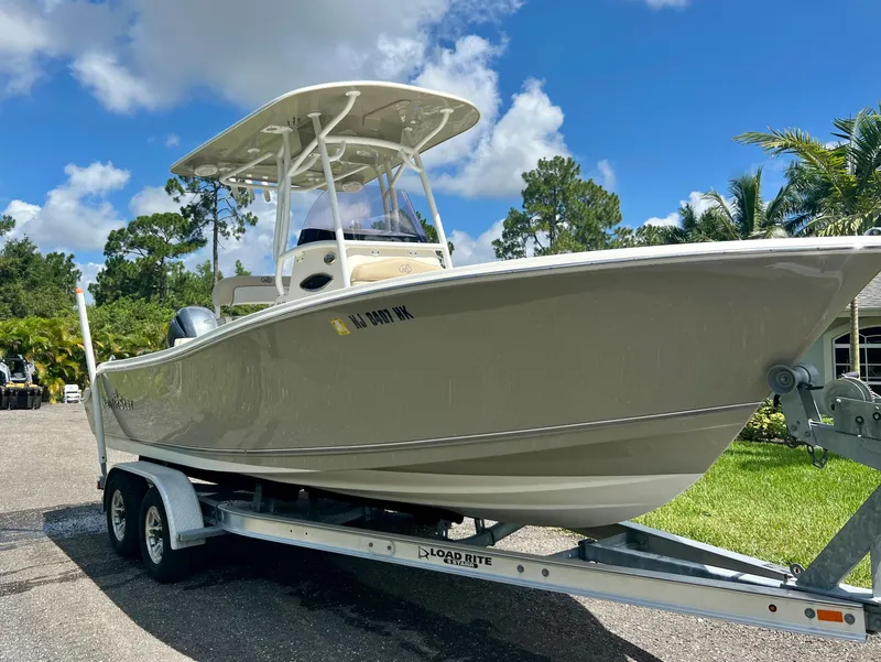 Slide: The Image of 2018 NauticStar 22 XS boat on a trailer, ready for transport. - 3