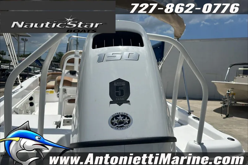 Slide: The Image of 2024 NauticStar 211 Hybrid boat displayed at Antonietti Marine dealership. - 10