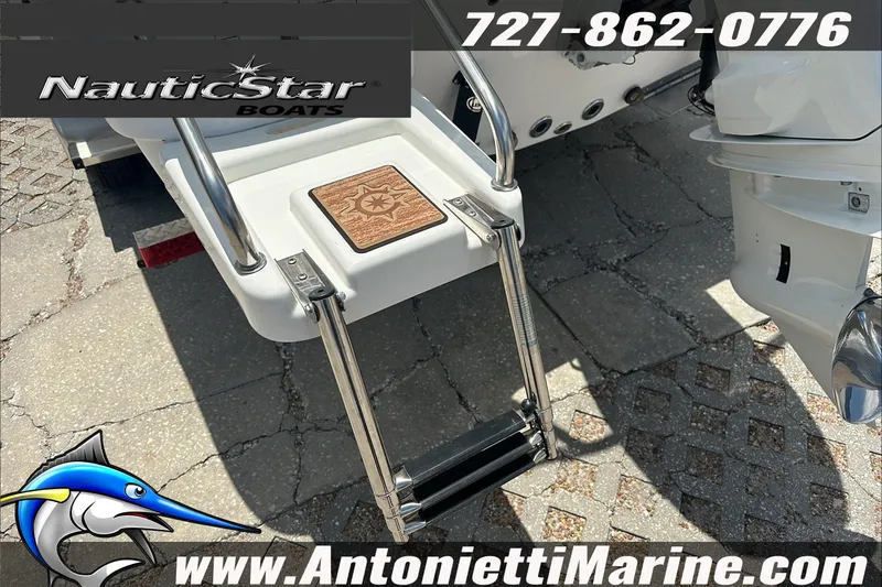 Slide: The Image of 2024 NauticStar 211 Hybrid boat ladder and logo at Antonietti Marine. - 11