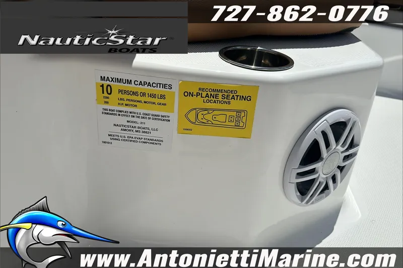 Slide: The Image of 2024 NauticStar 211 Hybrid boat capacity label and speaker detail. - 20