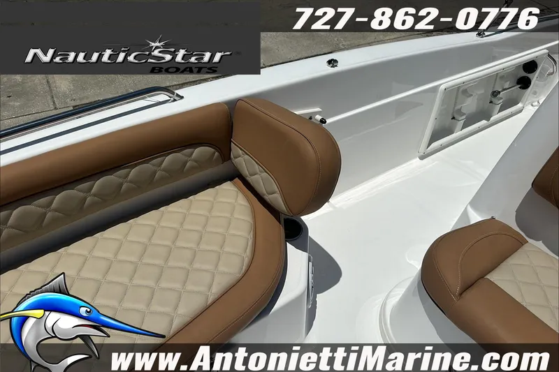 Slide: The Image of 2024 NauticStar 211 Hybrid boat interior with tan quilted seating, Antonietti Marine branding. - 24