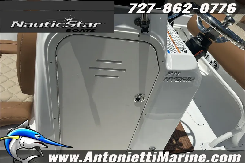 Slide: The Image of 2024 NauticStar 211 Hybrid boat console with steering wheel and seating, Antonietti Marine branding. - 25