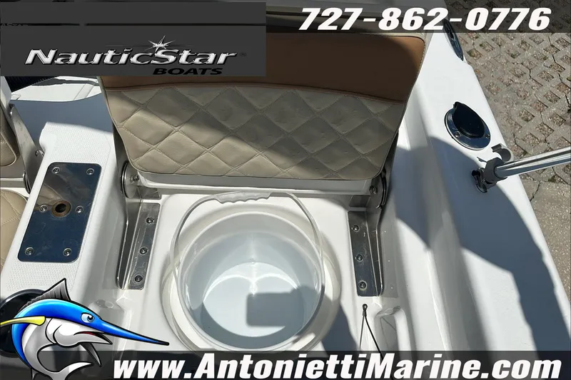 Slide: The Image of 2024 NauticStar 211 Hybrid boat interior with seating and storage compartment. - 30