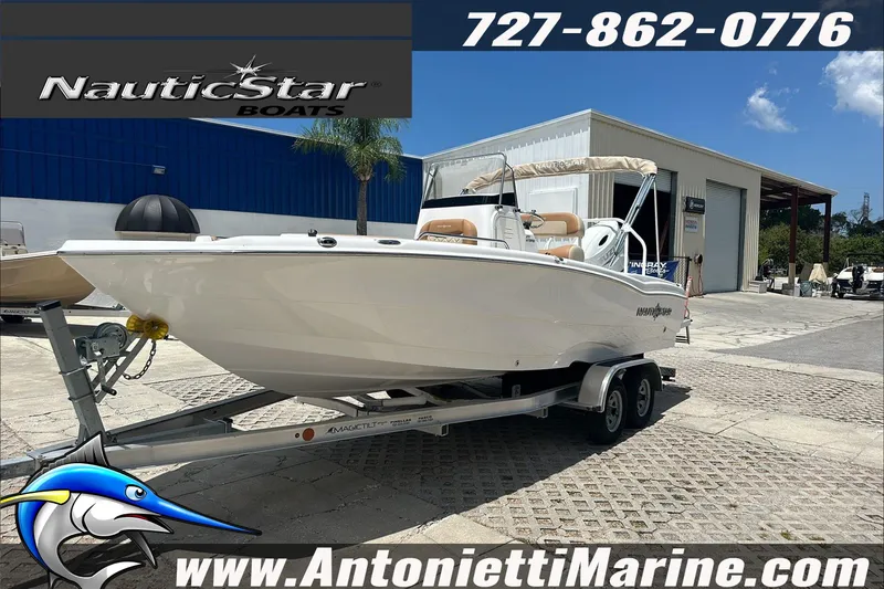 Slide: The Image of 2024 NauticStar 211 Hybrid boat on trailer at Antonietti Marine dealership. - 4
