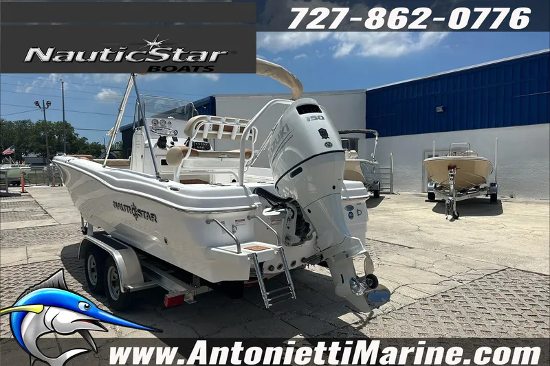 Slide: The Image of 2024 NauticStar 211 Hybrid boat displayed at Antonietti Marine dealership. - 6