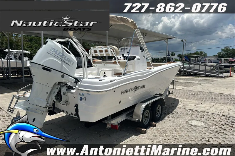 Slide: The Image of 2024 NauticStar 211 Hybrid boat with Suzuki engine on trailer at Antonietti Marine. - 8
