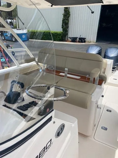Slide: The Image of 2017 Pursuit S 280 Sport boat interior with steering wheel and seating. - 15