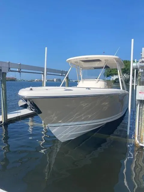 Slide: The Image of 2017 Pursuit S 280 Sport boat docked on a sunny day. - 2