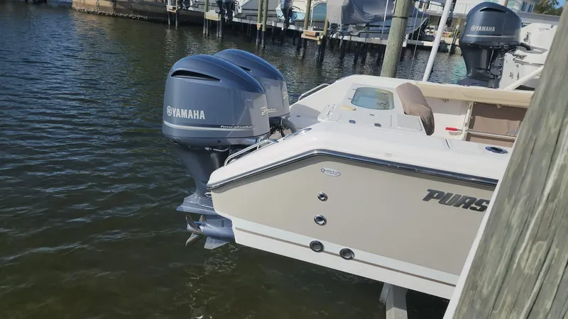 Slide: The Image of 2017 Pursuit S 280 Sport boat with Yamaha outboard engines docked in marina. - 23