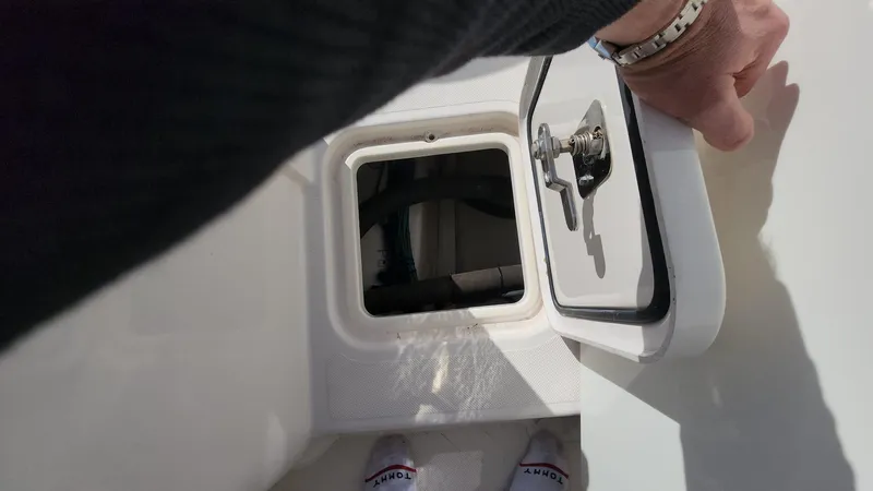 Slide: The Image of Opening hatch on 2017 Pursuit S 280 Sport boat deck. - 26