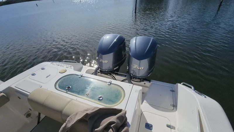 Slide: The Image of 2017 Pursuit S 280 Sport boat with twin 250 engines on calm water. - 28