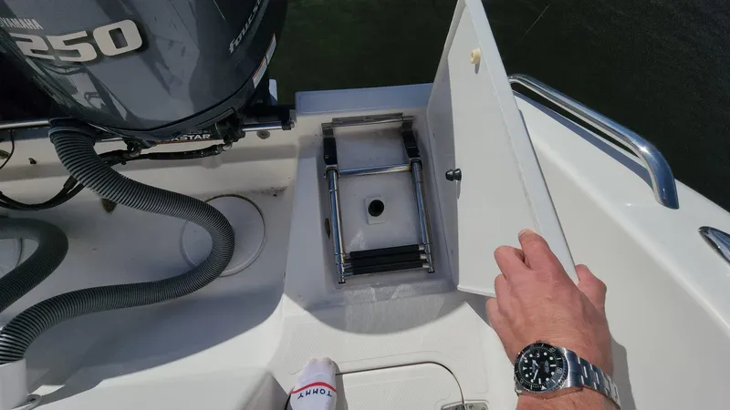 Slide: The Image of 2017 Pursuit S 280 Sport boat with ladder compartment and Yamaha 250 engine. - 32