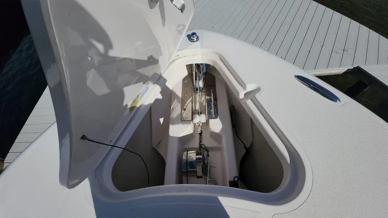 Slide: The Image of 2017 Pursuit S 280 Sport anchor compartment with open hatch. - 36