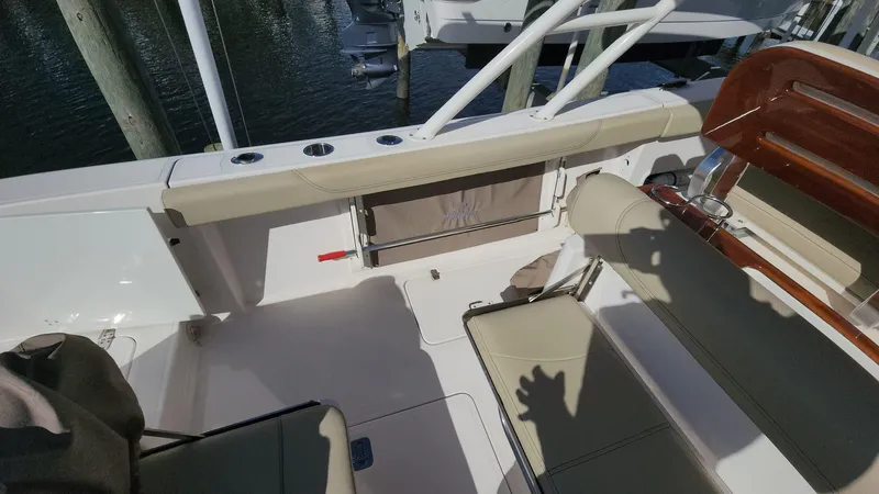 Slide: The Image of 2017 Pursuit S 280 Sport boat interior with seating and rod holders. - 37