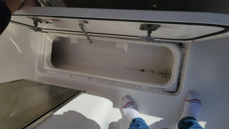 Slide: The Image of Open storage compartment on 2017 Pursuit S 280 Sport boat deck. - 43