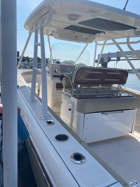 Slide: The Image of 2017 Pursuit S 280 Sport boat with seating and fishing rod holders. - 5