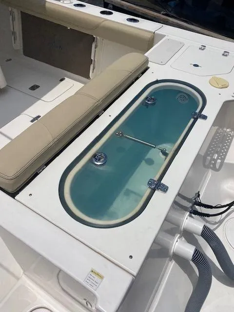 Slide: The Image of 2017 Pursuit S 280 Sport boat with livewell and seating area. - 7