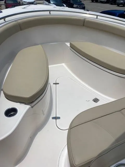 Slide: The Image of 2017 Pursuit S 280 Sport boat with beige seating and white deck. - 9
