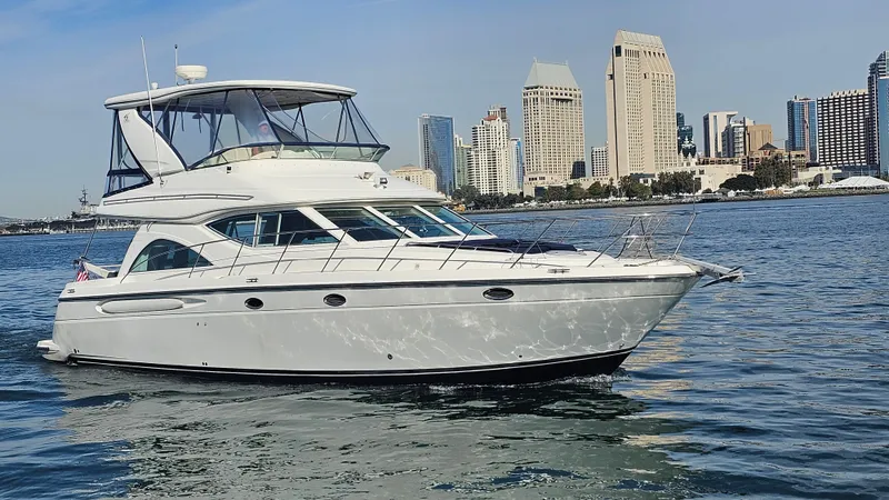 Slide: The Image of 2002 Maxum 4600 SCB yacht in front of city skyline. - 0