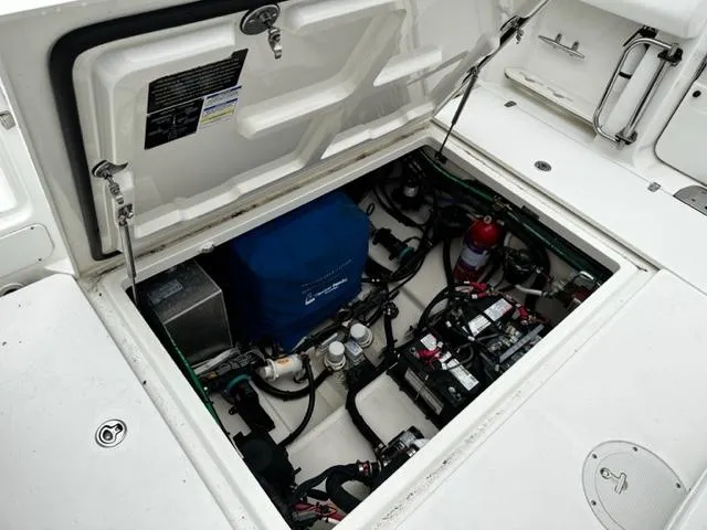 Slide: The Image of 2014 Boston Whaler 370 Outrage engine compartment with open hatch. - 5