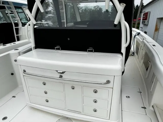 Slide: The Image of 2014 Boston Whaler 370 Outrage boat interior with storage compartments. - 6