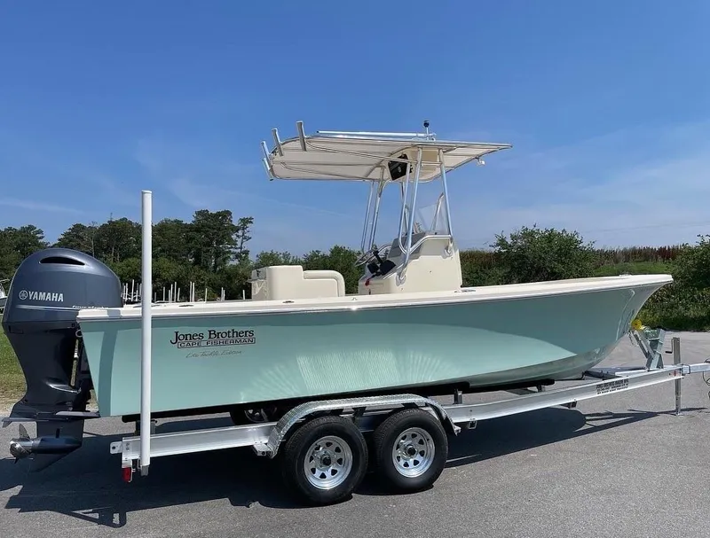 Slide: The Image of 2024 Jones Brothers Cape Fisherman 23 boat with cushioned seating. - 18