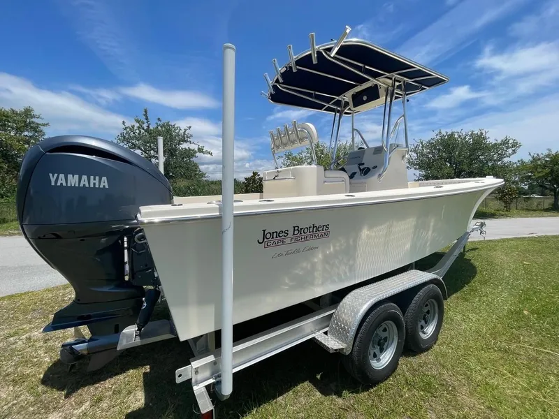 Slide: The Image of 2024 Jones Brothers Cape Fisherman 23 boat on a trailer with Yamaha outboard motor. - 19