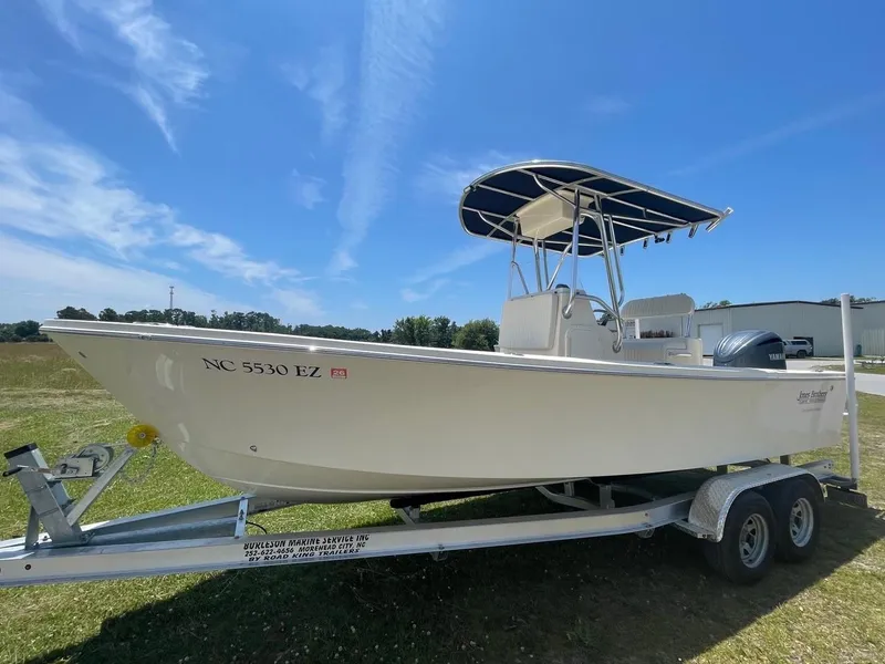 Slide: The Image of 2024 Jones Brothers Cape Fisherman 23 boat on trailer with Yamaha outboard motor. - 20