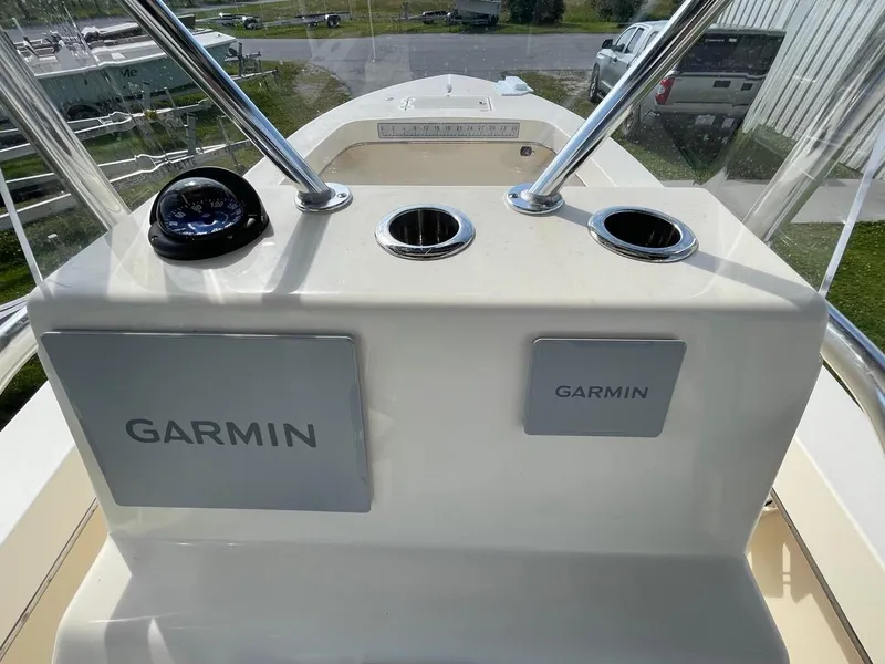 Slide: The Image of 2024 Jones Brothers Cape Fisherman 23 boat with rod holders and storage. - 26