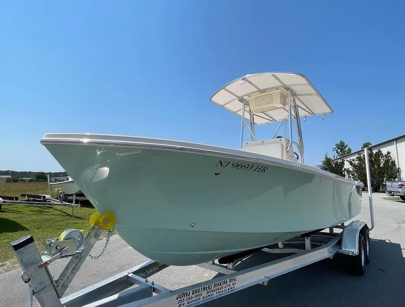 Slide: The Image of 2024 Jones Brothers Cape Fisherman 23 on trailer outside storage facility. - 3