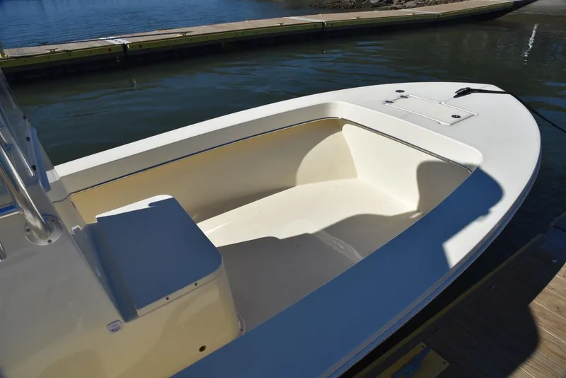 Slide: The Image of 2024 Jones Brothers Cape Fisherman 23 boat on trailer outside storage building. - 30