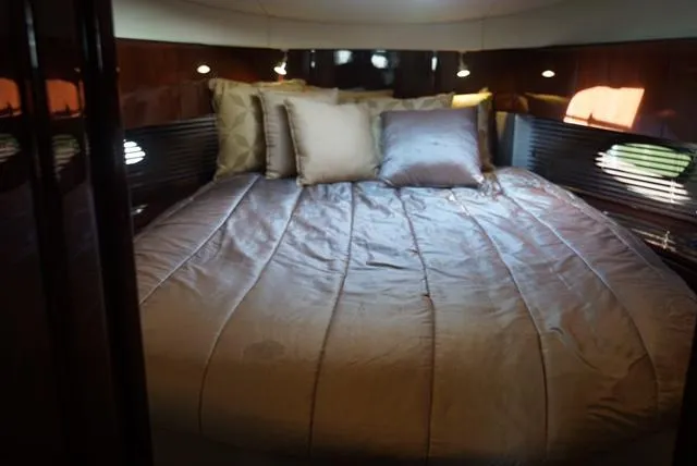 Slide: The Image of Luxurious bedroom interior of 2010 Sea Ray 470 Sundancer yacht. - 17