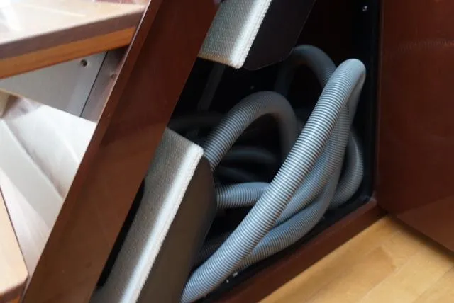 Slide: The Image of Coiled hoses in storage compartment of 2010 Sea Ray 470 Sundancer yacht. - 19