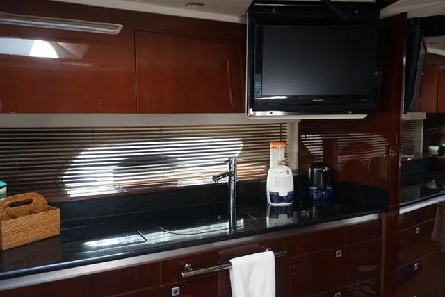 Slide: The Image of Luxurious kitchen interior of 2010 Sea Ray 470 Sundancer yacht with modern amenities. - 22