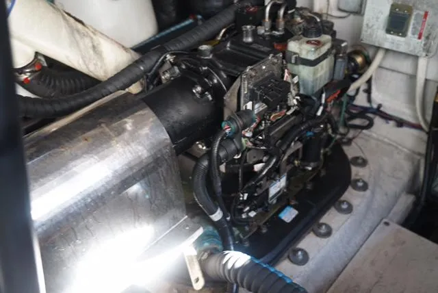 Slide: The Image of Engine compartment of 2010 Sea Ray 470 Sundancer yacht, showcasing mechanical components. - 28