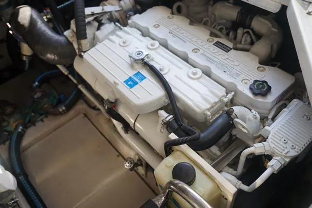 Slide: The Image of Engine compartment of 2010 Sea Ray 470 Sundancer boat, showcasing detailed machinery. - 29